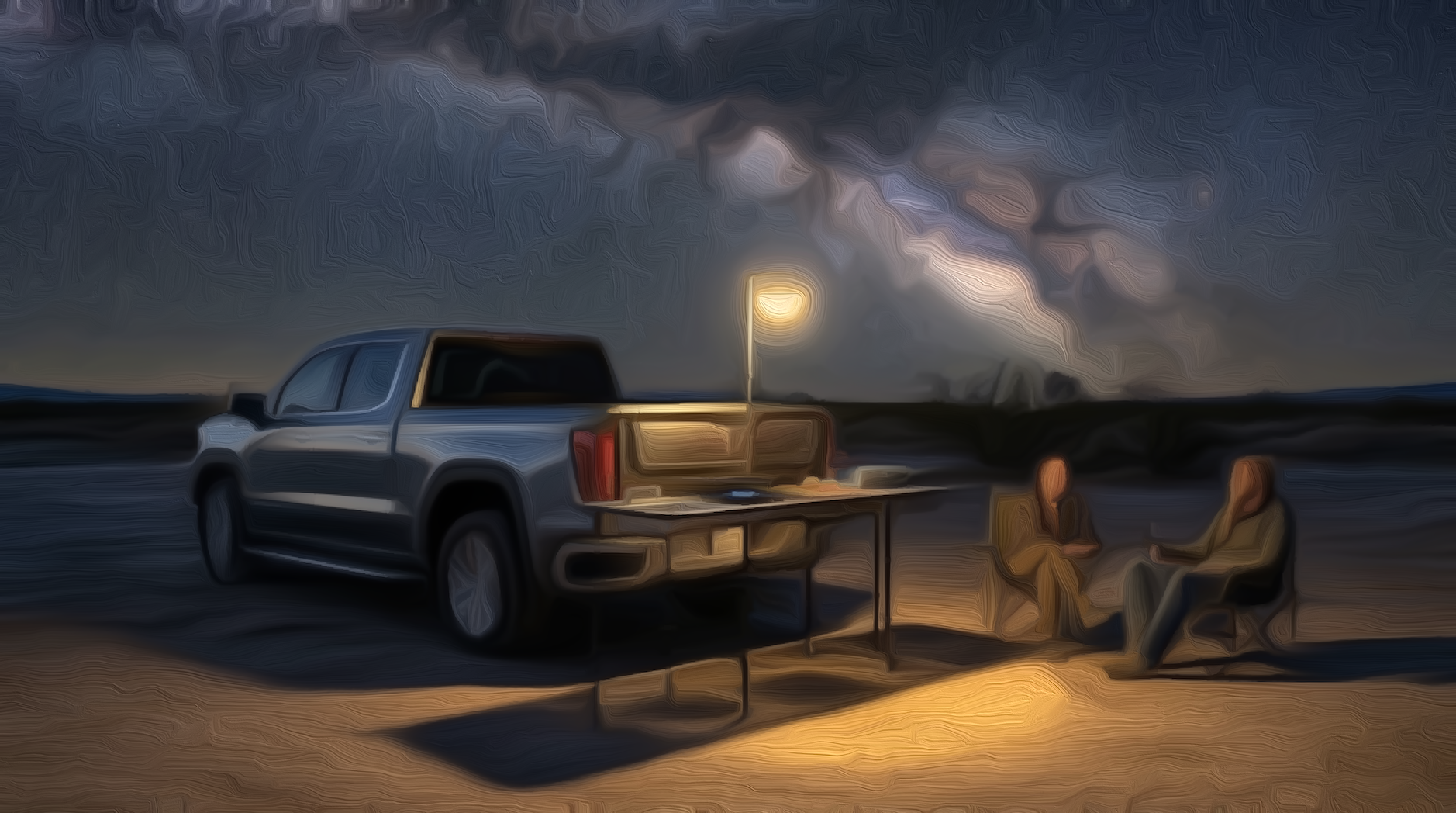 Desert dusk RAAK setup with light pole and two people seated