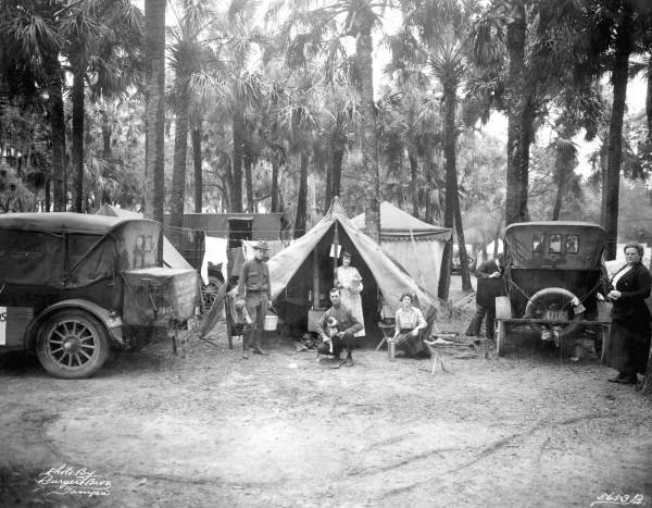Early auto campers with loaded Model T, circa 1914