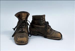 Eddie Bauer's personal field boots, well-worn leather, museum artifact