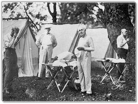 The Vagabonds at camp — Edison at center with folding tables and tents